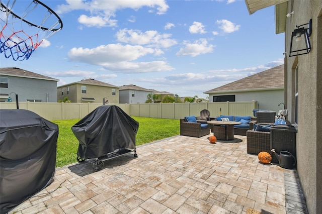 33678 Jasper Stone Dr, Wesley Chapel, FL 33543 - fenced backyard with outdoor lounge area, a patio area, a grill, and a residential view