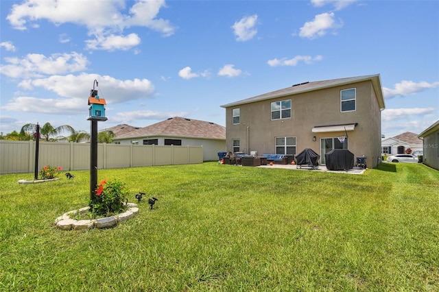33678 Jasper Stone Dr, Wesley Chapel, FL 33543 - back of house featuring stucco siding, outdoor lounge area, and a patio area