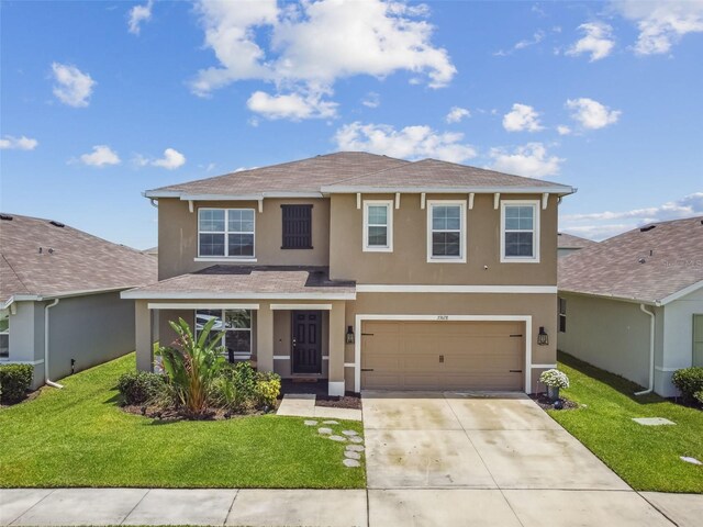 33678 Jasper Stone Dr, Wesley Chapel, FL 33543 - traditional-style home with stucco siding, roof with shingles, driveway, and a front yard