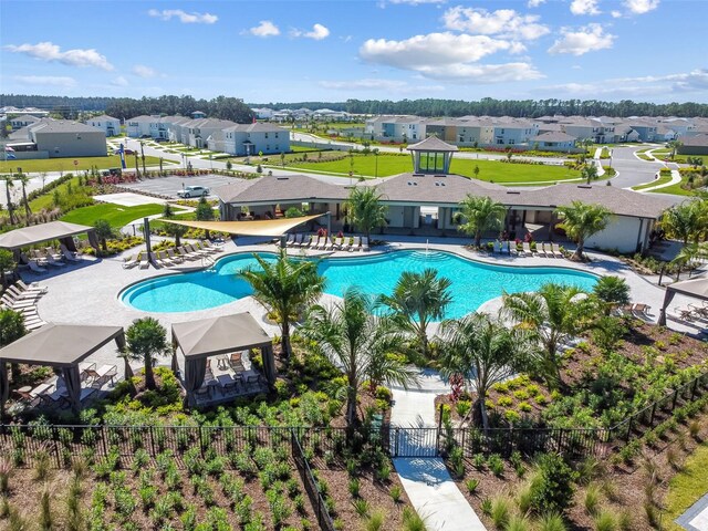 33678 Jasper Stone Dr, Wesley Chapel, FL 33543 - community pool with a residential view and a patio