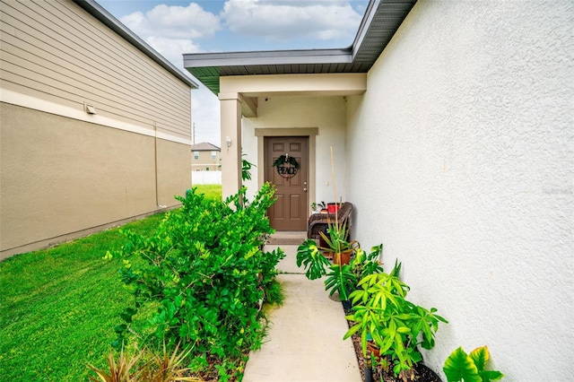 35210 Daisy Meadow Loop, Zephyrhills, FL 33541 - property entrance with stucco siding