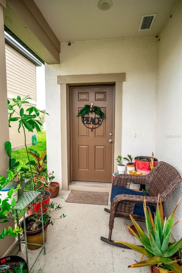 35210 Daisy Meadow Loop, Zephyrhills, FL 33541 - property entrance with stucco siding