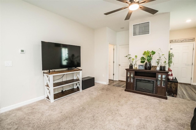 35210 Daisy Meadow Loop, Zephyrhills, FL 33541 - living area with ceiling fan and carpet flooring