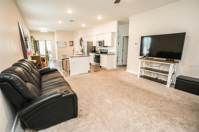 35210 Daisy Meadow Loop, Zephyrhills, FL 33541 - living room featuring recessed lighting, ceiling fan, and light carpet