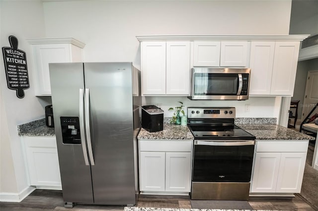 35210 Daisy Meadow Loop, Zephyrhills, FL 33541 - kitchen with appliances with stainless steel finishes, dark wood finished floors, stone counters, and white cabinets