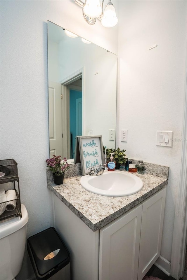 35210 Daisy Meadow Loop, Zephyrhills, FL 33541 - bathroom featuring vanity and toilet
