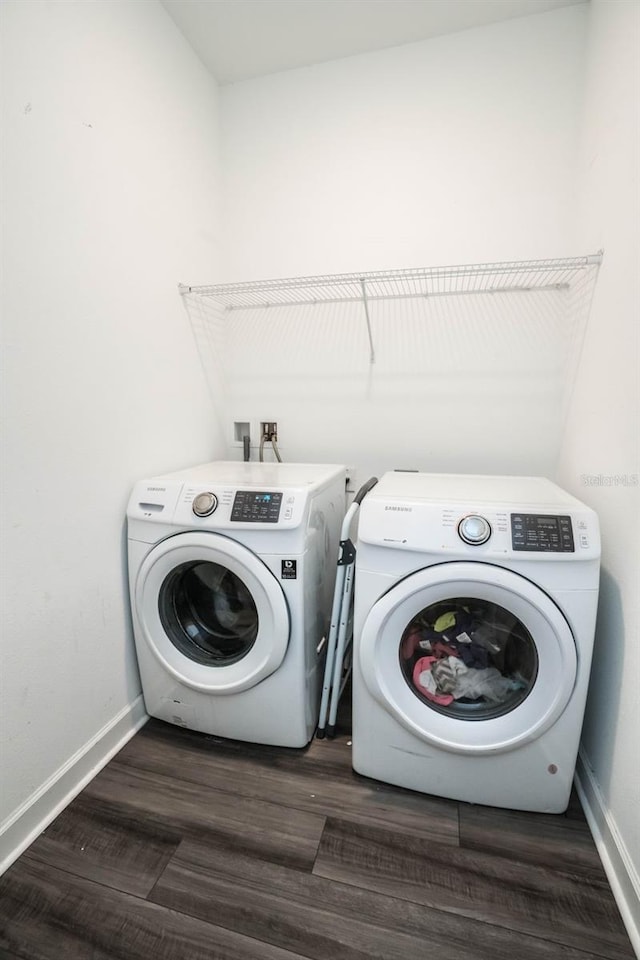 35210 Daisy Meadow Loop, Zephyrhills, FL 33541 - laundry room with washer and dryer and dark wood-style floors