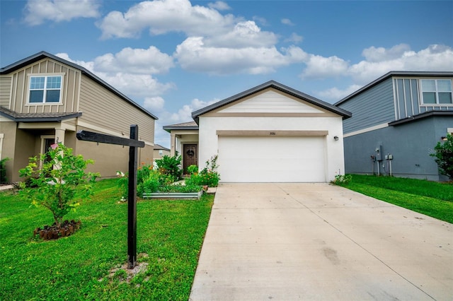35210 Daisy Meadow Loop, Zephyrhills, FL 33541 - view of front facade featuring a front yard, driveway, an attached garage, and stucco siding