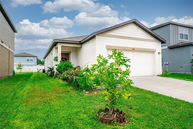 35210 Daisy Meadow Loop, Zephyrhills, FL 33541 - view of front facade featuring an attached garage, driveway, a front yard, and stucco siding