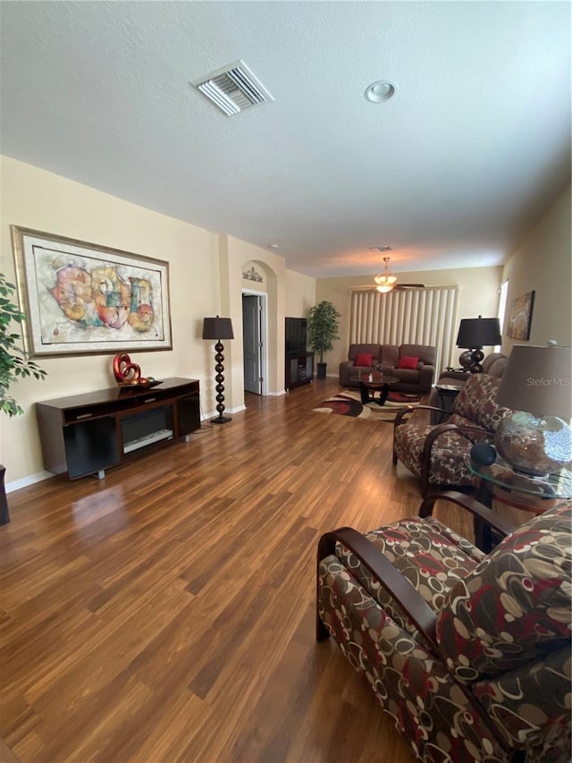 11439 Cambray Creek Loop, Riverview, FL 33579 - living room featuring wood finished floors and a textured ceiling