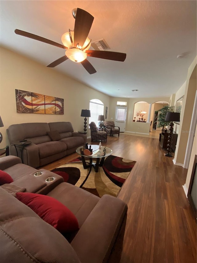 11439 Cambray Creek Loop, Riverview, FL 33579 - living area with arched walkways, wood finished floors, and a ceiling fan