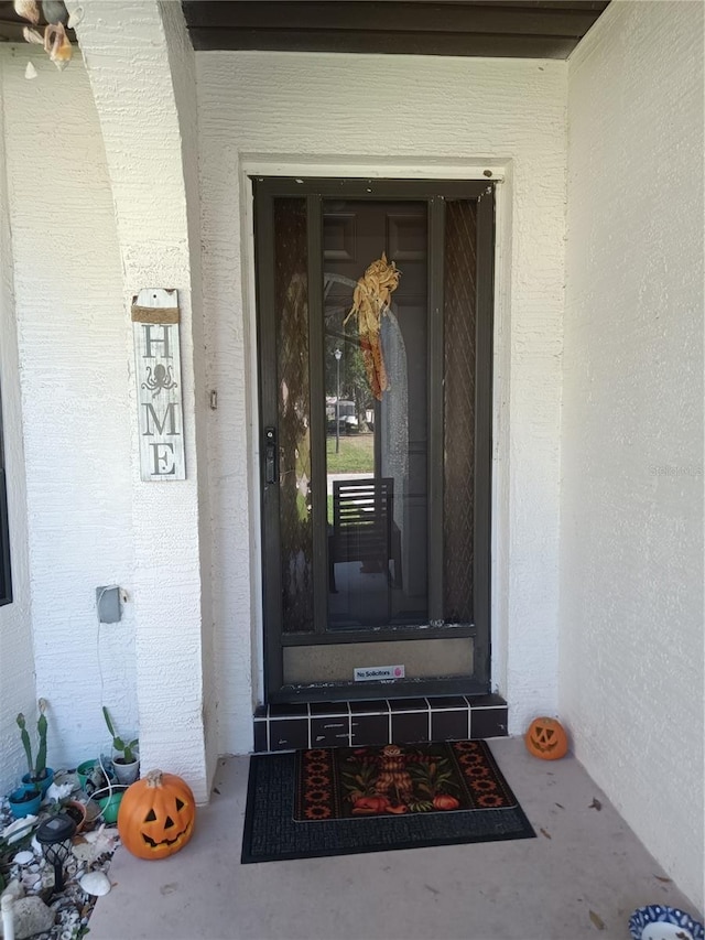 7307 Windsor Mill Rd, Hudson, FL 34667 - property entrance featuring stucco siding