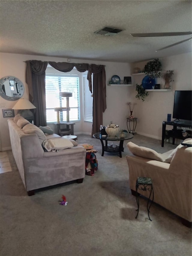 7307 Windsor Mill Rd, Hudson, FL 34667 - living area featuring a textured ceiling and carpet flooring