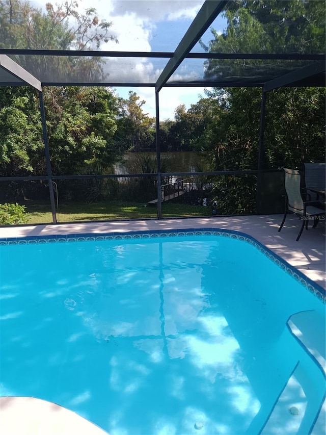 7307 Windsor Mill Rd, Hudson, FL 34667 - swimming pool featuring a lanai and a patio