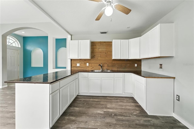 1725 Bondurant Way, Brandon, FL 33511 - kitchen featuring a peninsula, ceiling fan, dark wood-style flooring, and arched walkways