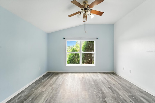 1725 Bondurant Way, Brandon, FL 33511 - unfurnished room with vaulted ceiling, wood finished floors, and a ceiling fan