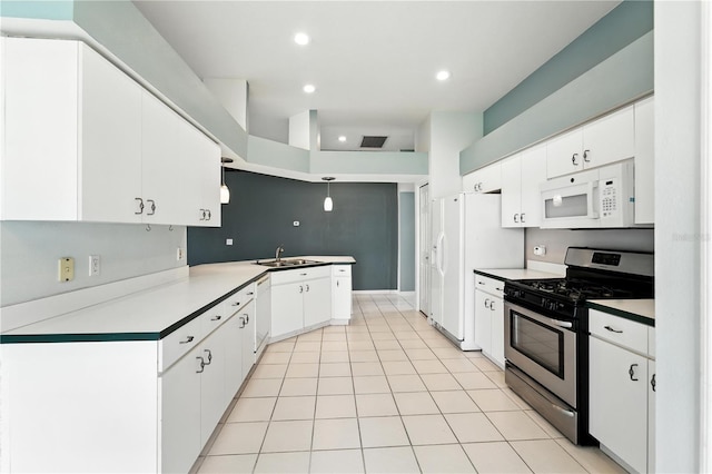 1725 Bondurant Way, Brandon, FL 33511 - kitchen with white appliances, white cabinetry, recessed lighting, a peninsula, and light tile patterned floors