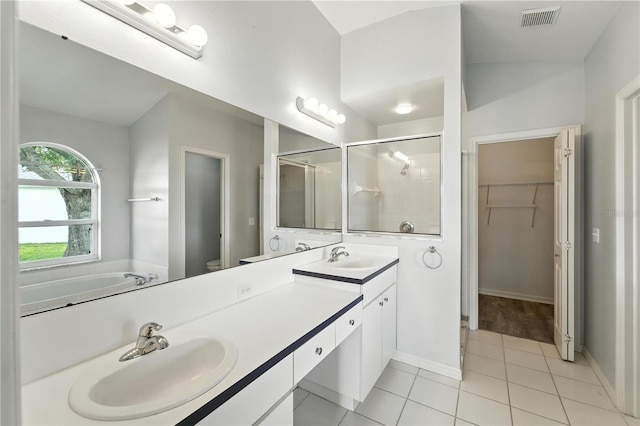 1725 Bondurant Way, Brandon, FL 33511 - bathroom featuring a stall shower, double vanity, a spacious closet, tile patterned floors, and a bath