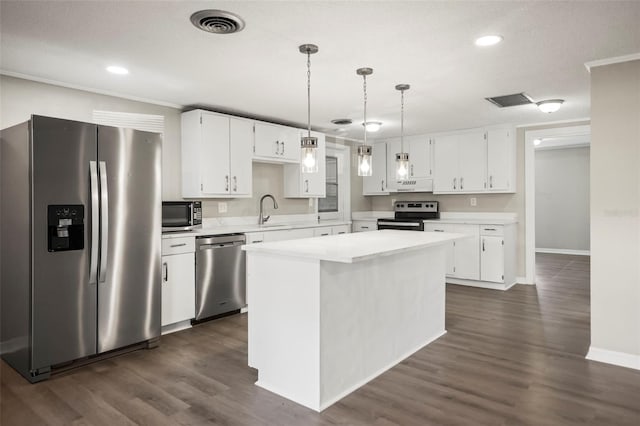 1018 Osprey Ct, Dunedin, FL 34698 - kitchen featuring appliances with stainless steel finishes, white cabinets, light countertops, and recessed lighting