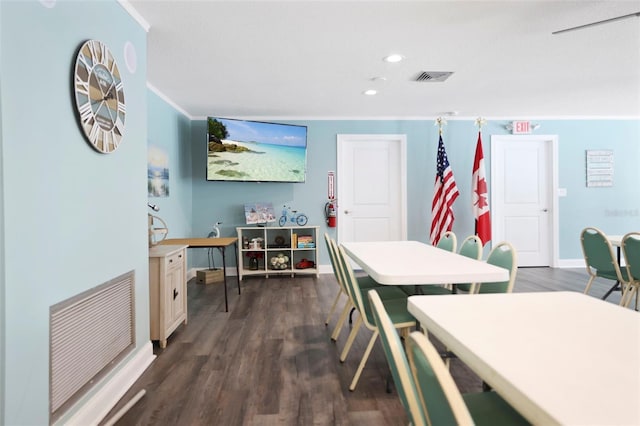 1018 Osprey Ct, Dunedin, FL 34698 - dining space with ornamental molding, dark wood-style floors, and recessed lighting