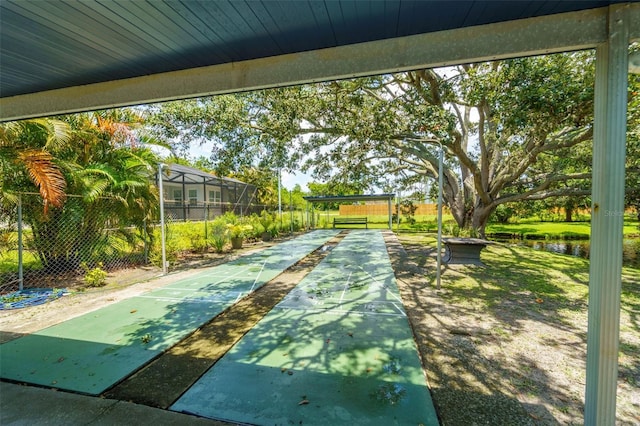 1018 Osprey Ct, Dunedin, FL 34698 - surrounding community with shuffleboard and a water view