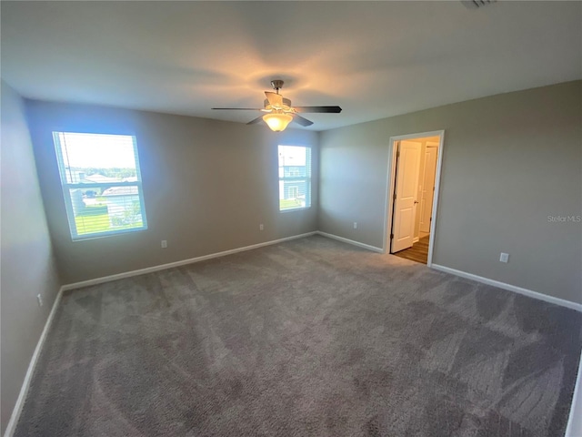 35233 White Water Lily Way, Zephyrhills, FL 33541 - spare room with carpet floors and a ceiling fan