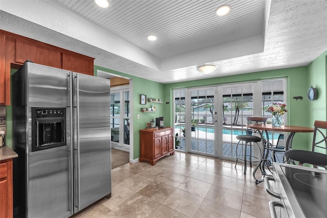 617 Valley Hill Dr, Brandon, FL 33510 - kitchen featuring appliances with stainless steel finishes, french doors, a tray ceiling, recessed lighting, and light tile patterned floors