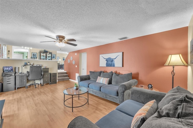 617 Valley Hill Dr, Brandon, FL 33510 - living area featuring stairs, wood finished floors, a ceiling fan, an office area, and a textured ceiling