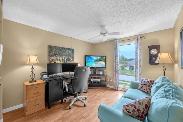 617 Valley Hill Dr, Brandon, FL 33510 - office area featuring light wood-style flooring, ceiling fan, and a textured ceiling