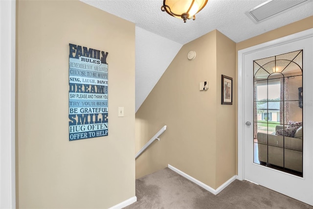 617 Valley Hill Dr, Brandon, FL 33510 - carpeted entryway with baseboards and a textured ceiling