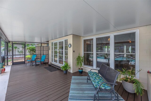 617 Valley Hill Dr, Brandon, FL 33510 - sunroom / solarium with wood finished floors, a deck, and expansive windows