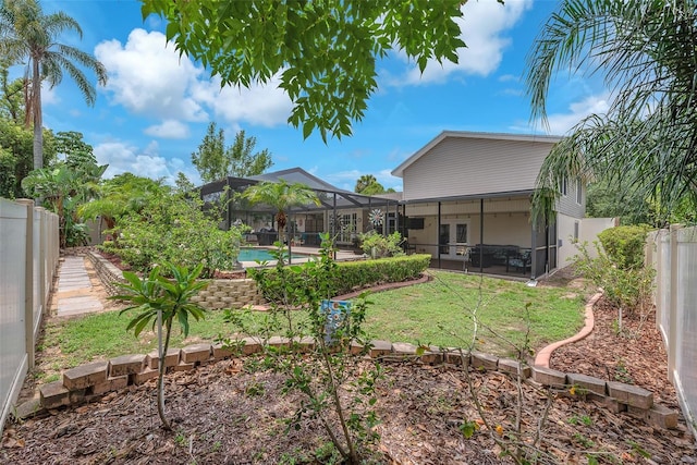 617 Valley Hill Dr, Brandon, FL 33510 - fenced backyard with french doors, glass enclosure, and a patio area