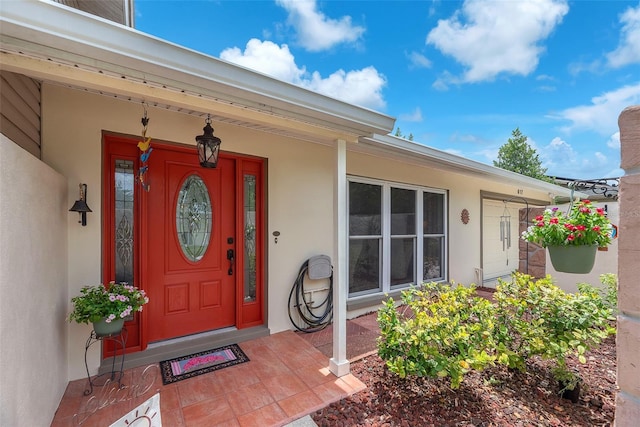 617 Valley Hill Dr, Brandon, FL 33510 - doorway to property with stucco siding and a porch