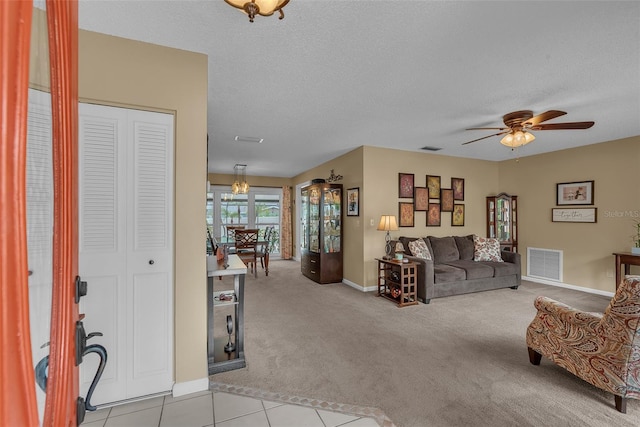 617 Valley Hill Dr, Brandon, FL 33510 - living room with a ceiling fan, light carpet, and a textured ceiling