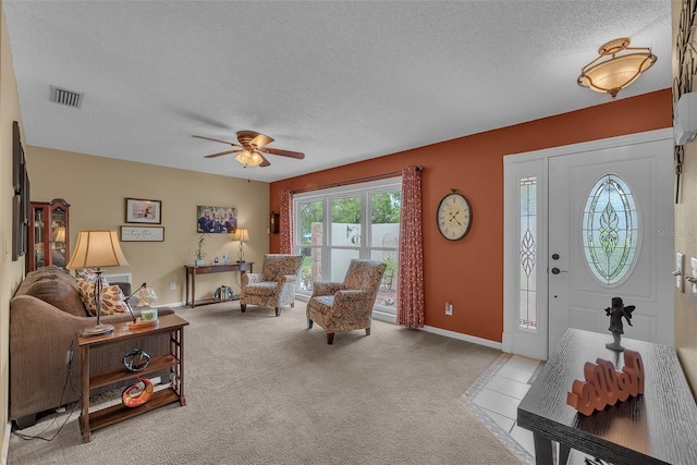 617 Valley Hill Dr, Brandon, FL 33510 - living room with a textured ceiling, a ceiling fan, and carpet flooring