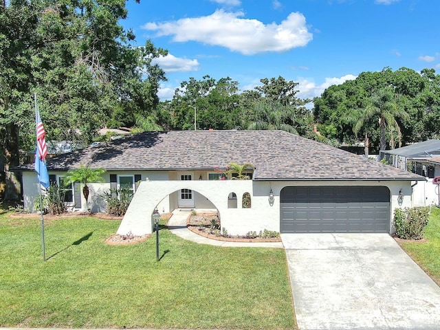 3840 Rolling Cir, Valrico, FL 33594 - view of front facade featuring a garage, concrete driveway, a front lawn, and stucco siding