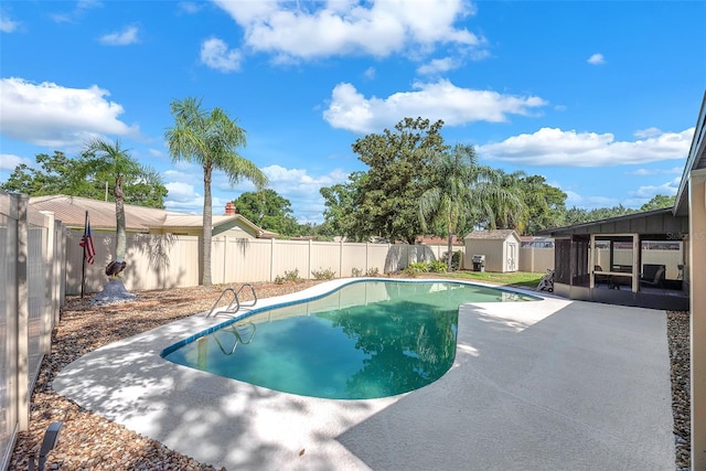 3840 Rolling Cir, Valrico, FL 33594 - view of swimming pool featuring a storage unit, a patio area, and a fenced backyard