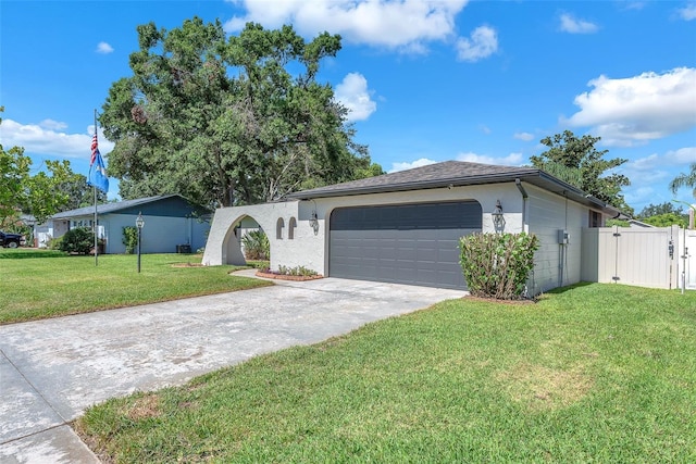3840 Rolling Cir, Valrico, FL 33594 - ranch-style house with concrete driveway, a gate, an attached garage, and stucco siding