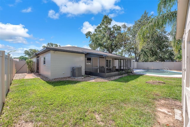 3840 Rolling Cir, Valrico, FL 33594 - rear view of property with a sunroom and a fenced backyard