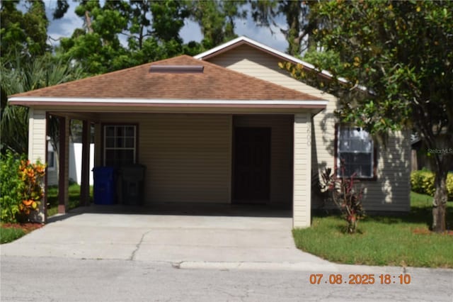 3600 Raintree Ter, Lakeland, FL 33803 - view of front of home featuring a shingled roof and concrete driveway