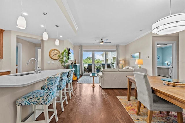200 Main St Unit 204, Dunedin, FL 34698 - dining space with ornamental molding, dark wood-style floors, a ceiling fan, and recessed lighting