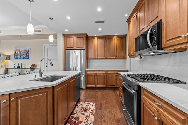 200 Main St Unit 204, Dunedin, FL 34698 - kitchen featuring appliances with stainless steel finishes, brown cabinets, backsplash, dark wood-style flooring, and recessed lighting