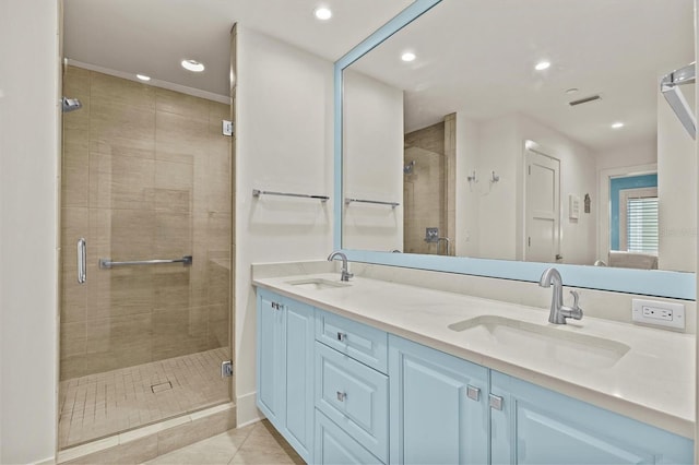 200 Main St Unit 204, Dunedin, FL 34698 - bathroom featuring a stall shower, double vanity, tile patterned flooring, and recessed lighting