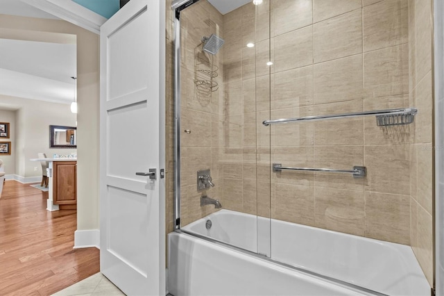 200 Main St Unit 204, Dunedin, FL 34698 - full bath with vanity, shower / bath combination with glass door, and wood finished floors