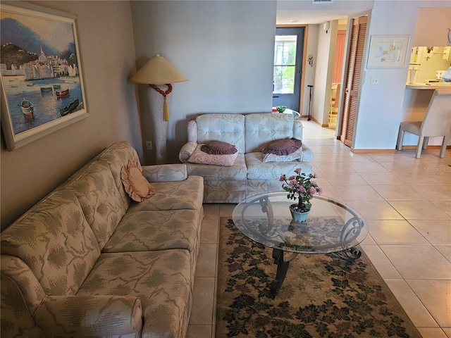 3849 Sailmaker Ln Unit 0, Holiday, FL 34691 - living area featuring light tile patterned flooring and baseboards