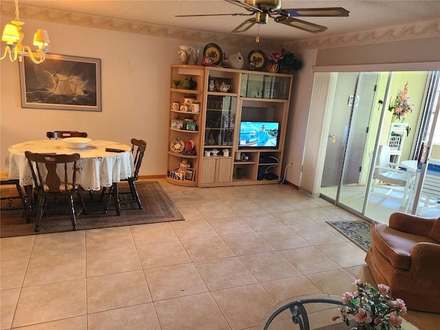 3849 Sailmaker Ln Unit 0, Holiday, FL 34691 - dining space with a ceiling fan, a chandelier, and light tile patterned flooring