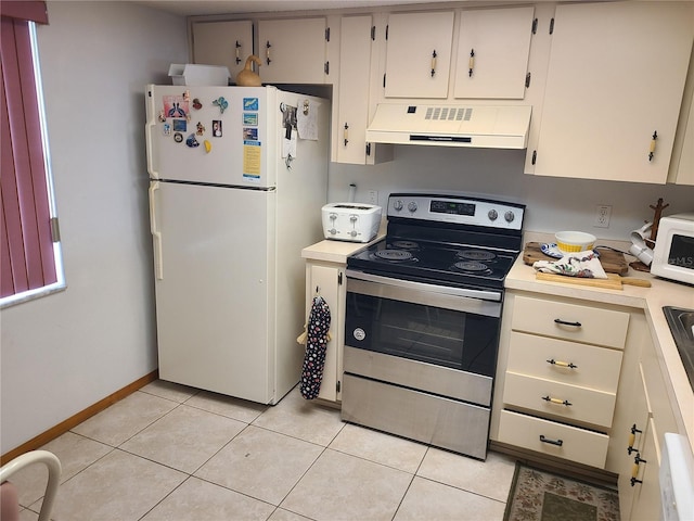 3849 Sailmaker Ln Unit 0, Holiday, FL 34691 - kitchen with premium range hood, white appliances, light countertops, and light tile patterned floors