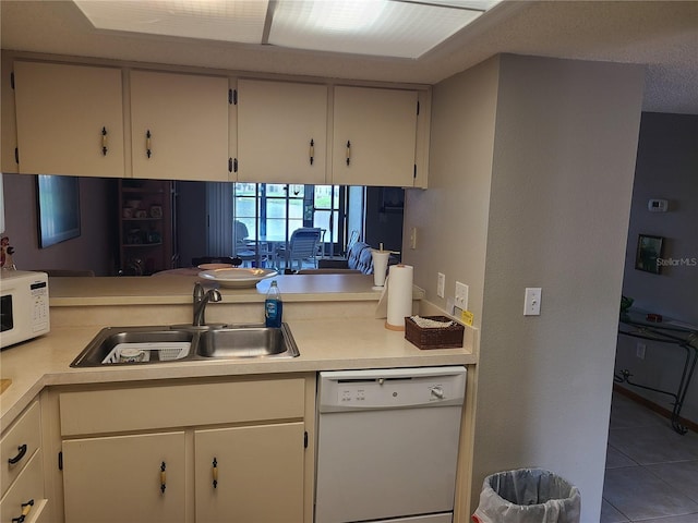 3849 Sailmaker Ln Unit 0, Holiday, FL 34691 - kitchen with white appliances, light countertops, and tile patterned floors