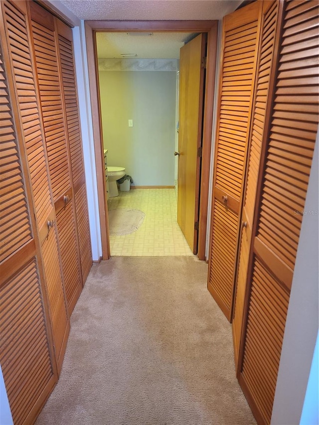 3849 Sailmaker Ln Unit 0, Holiday, FL 34691 - hallway featuring tile patterned floors and carpet floors