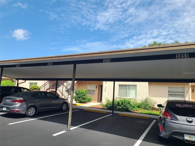 3849 Sailmaker Ln Unit 0, Holiday, FL 34691 - covered parking lot featuring stairway